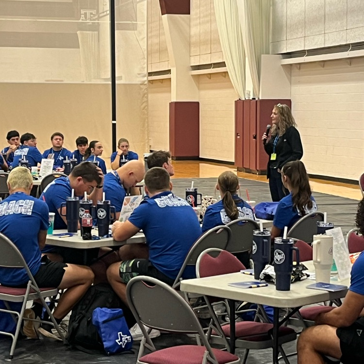 Coach Dena giving the into speech  