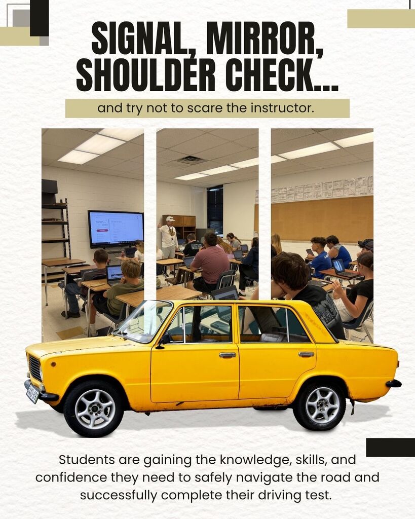Yellow car in a classroom with students learning how to drive. The text "SIGNAL, MIRROR, SHOULDER CHECK" is visible.