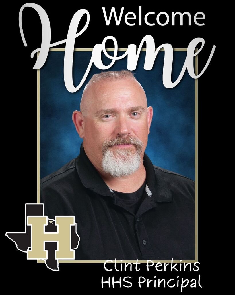 Man with short hair and a beard. He wears a black polo shirt. The words "Welcome Home" are above him.
