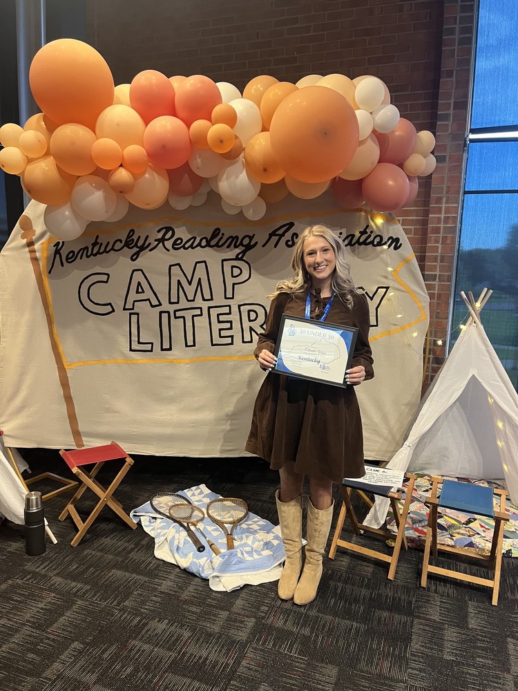 woman holding certificate for literacy