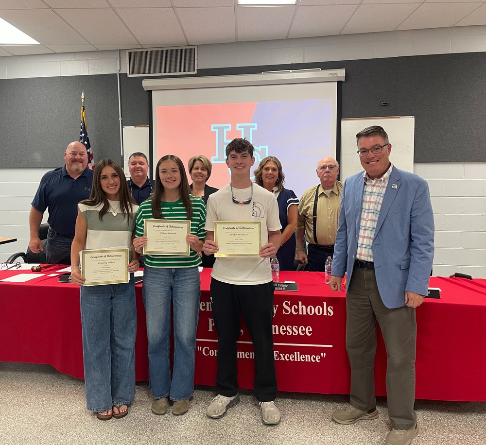 students and board members standing
