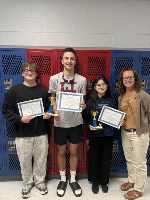 students with trophies