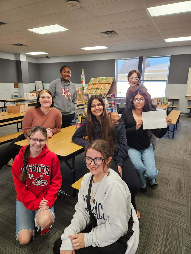 high school students with canned goods