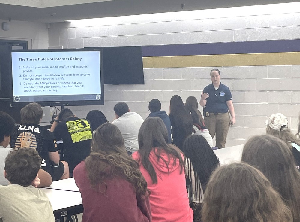 TBI Officer talks to group of students