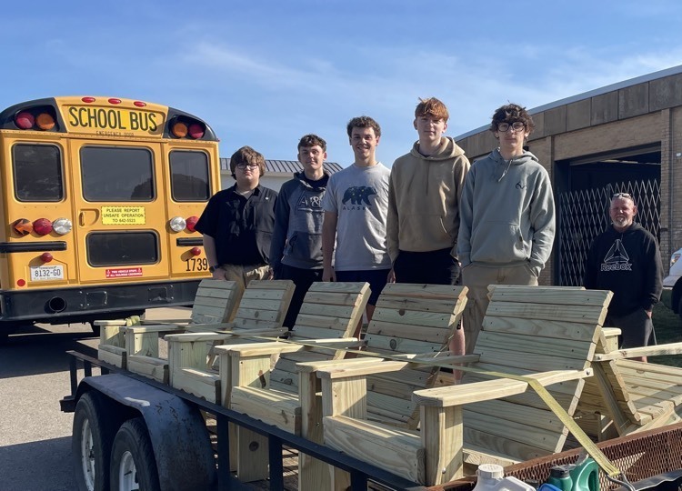 group of students with chairs