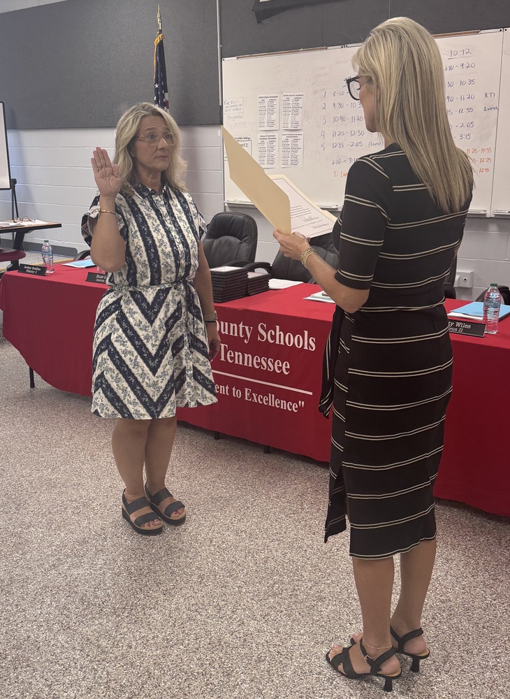 board member being sworn in
