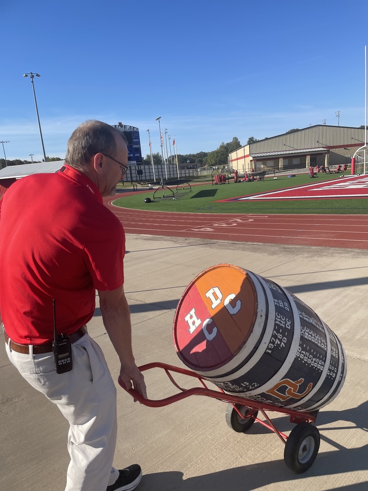 man rolls out a barrel