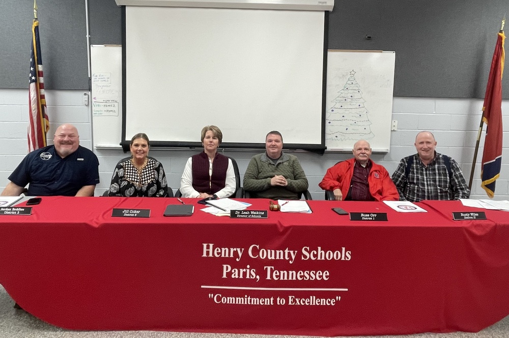school board members sitting behind a desk