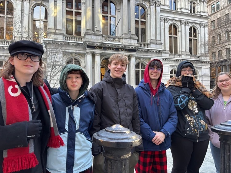 group of students in front of building 