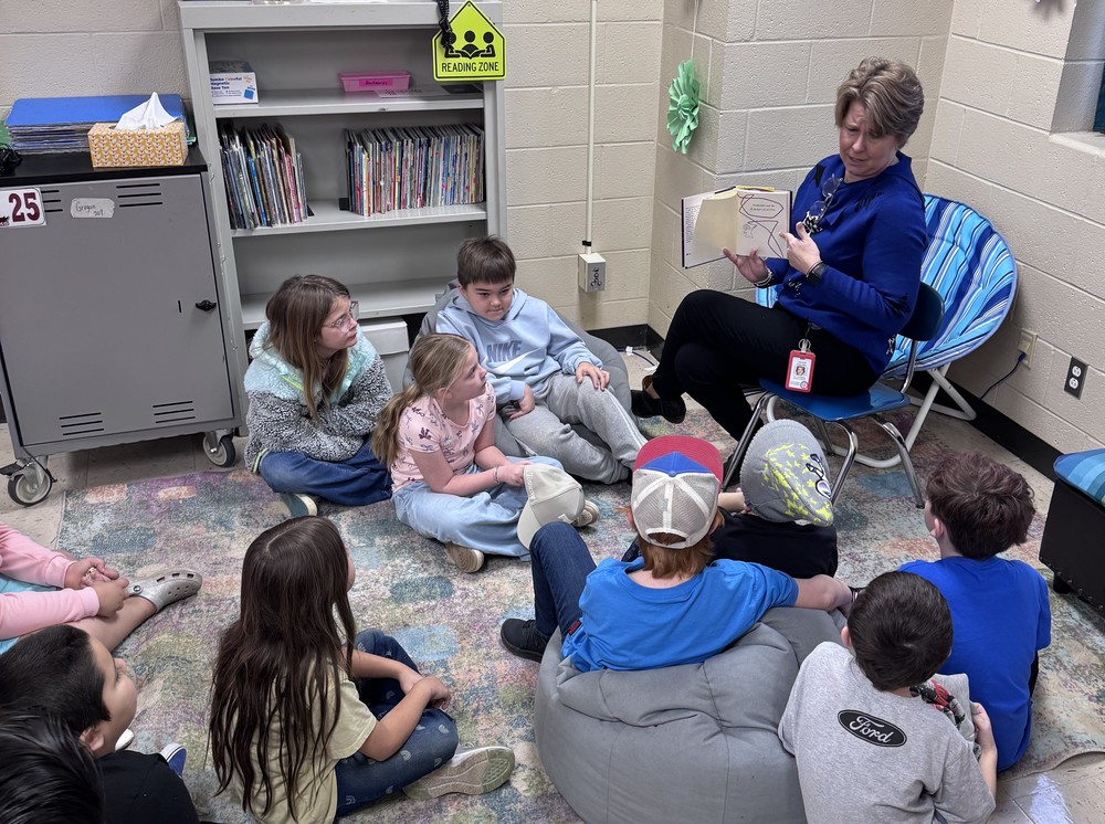 woman reading to kids
