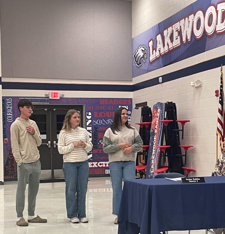 Three students standing