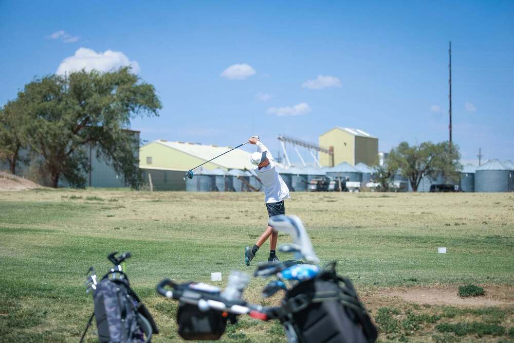 Corey Mendoza Swinging a Golf Ball