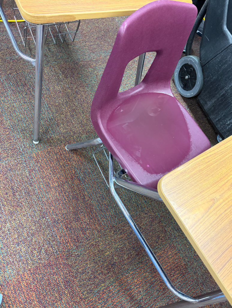student desk chair filled with water