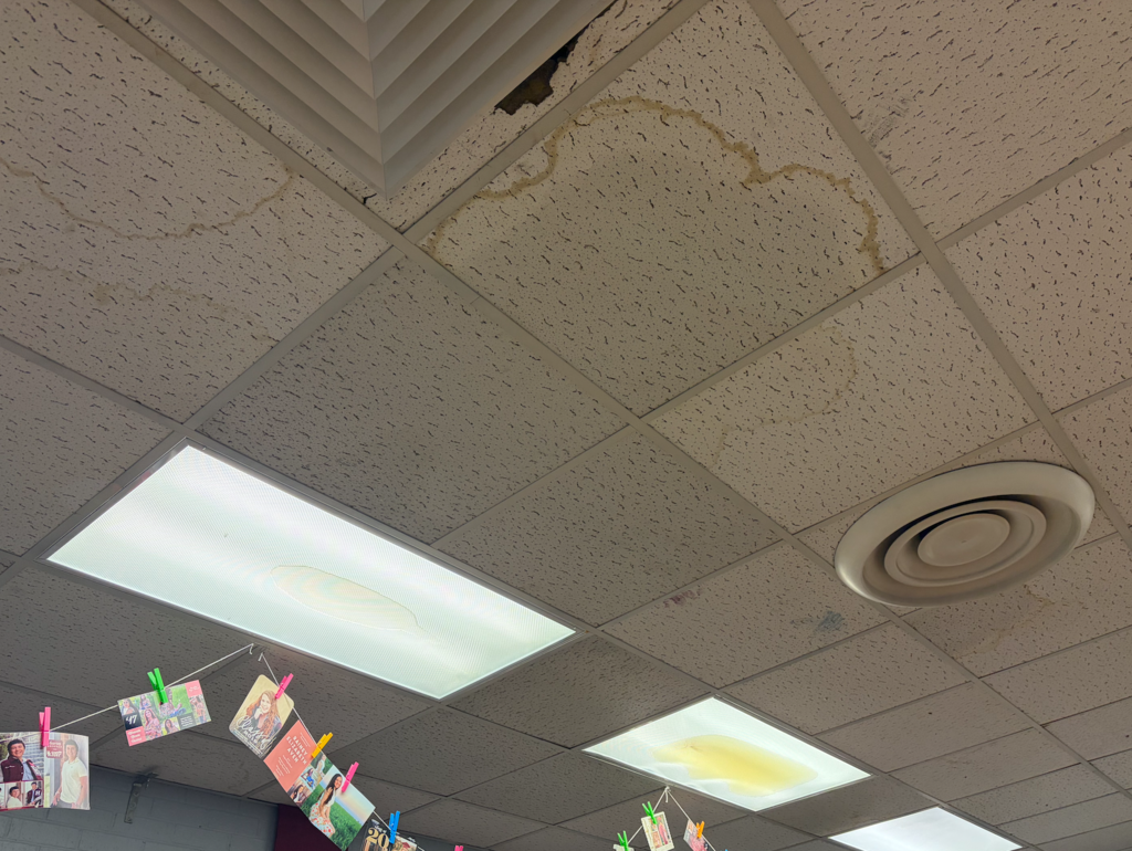 Water in the ceiling and in the lights of a history classroom