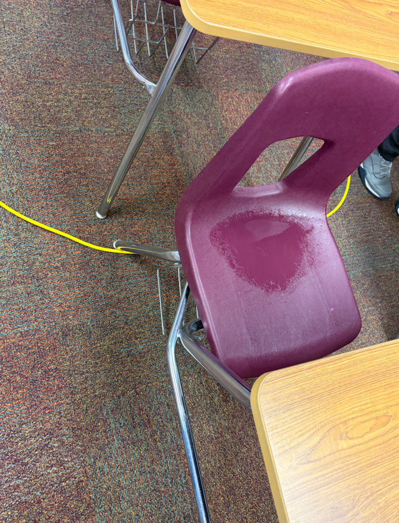 another student chair filled with water