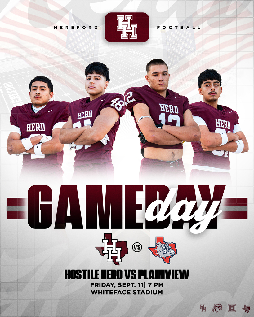 Four players in maroon jerseys with the word "HERD" printed on the back stand with arms crossed.
