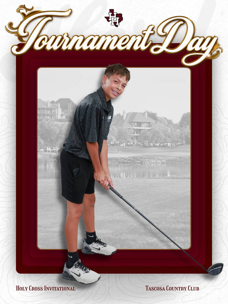 A boy in shorts and a gray shirt plays golf on a course with houses in the background.