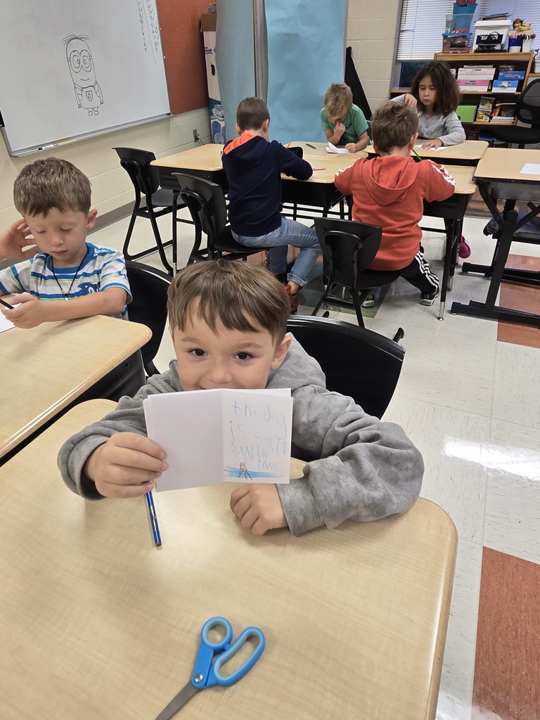 A first grader with his book.