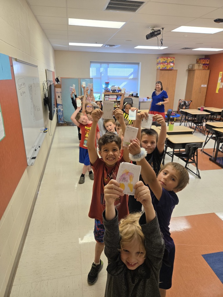 Second graders with their books