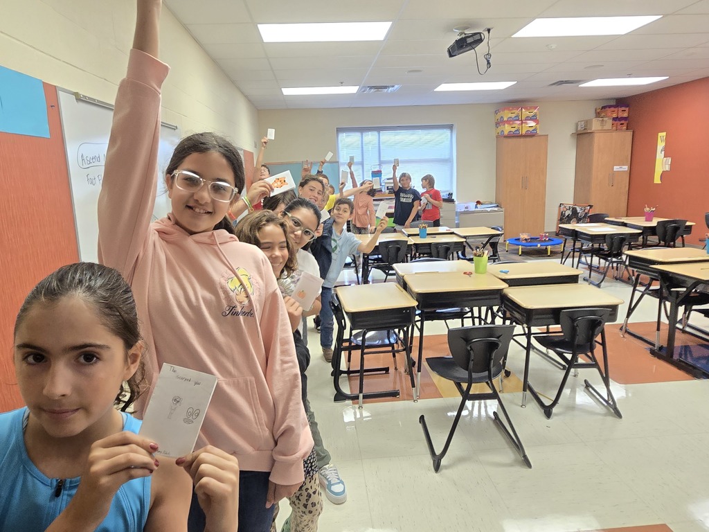 Some fifth graders with their books.