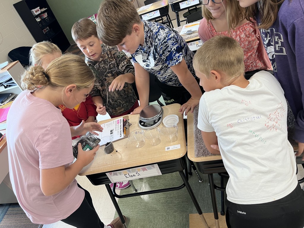 Fifth graders doing an experiment with onions.