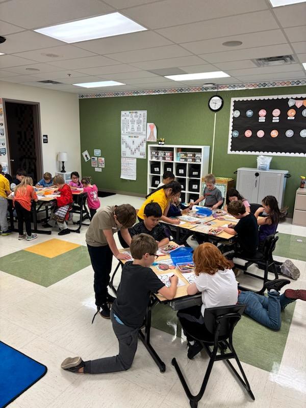 Second graders work with kindergarten