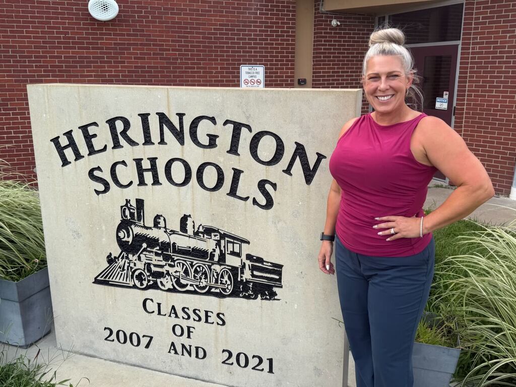 Dr. Webb outside Herington Schools 