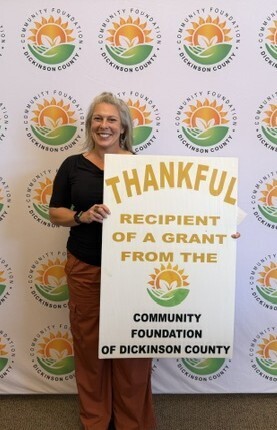Picture with grant sign