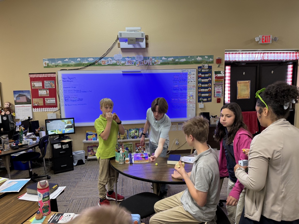 students play with a ping pong ball on the table