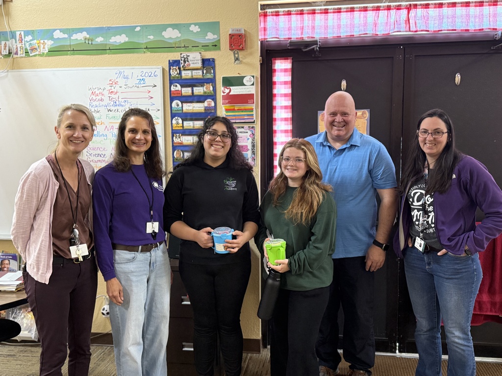 teachers and students pose for a group photo