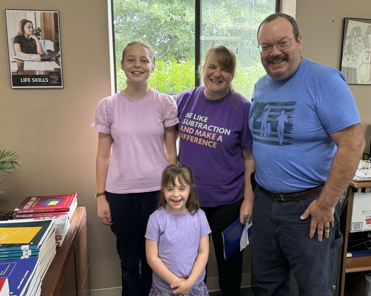 family standing smiling