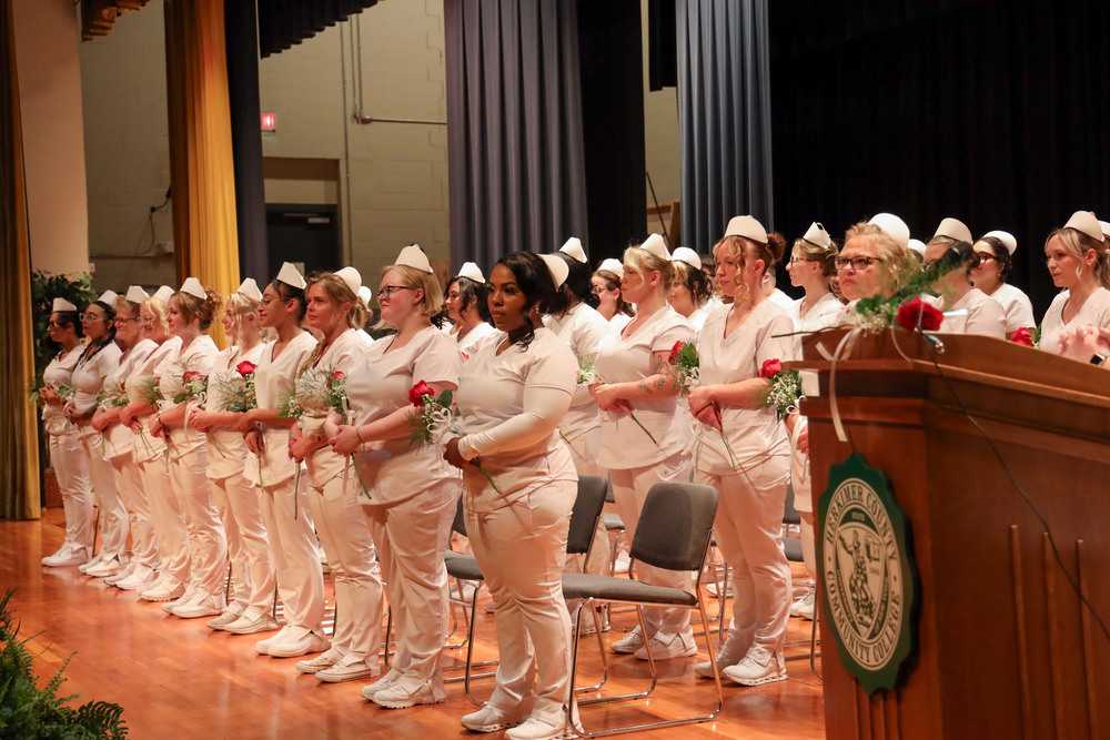 Nursing graduates on stage