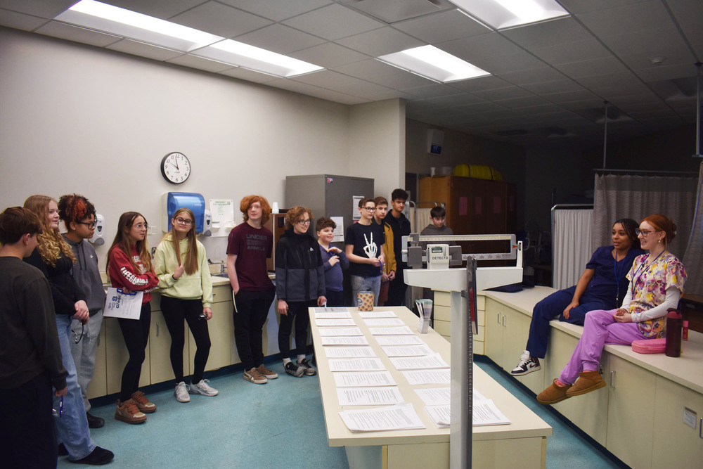 Students presenting to 8th graders in Health Science lab