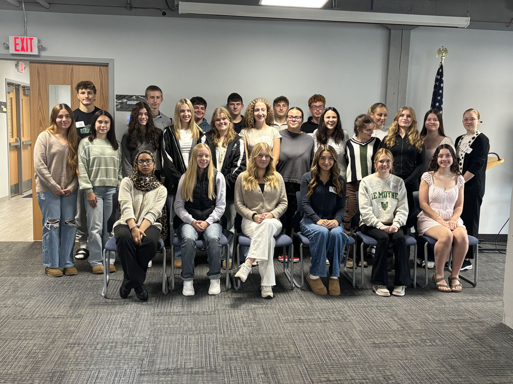 Student Board of Education members sitting and standing together for a posed photo