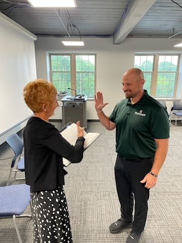 Rick Virkler getting sworn in to the Board of Education by Shawn Maxson
