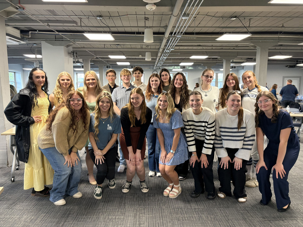 19 ACIE students pose together