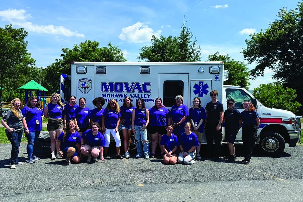 Students and STC and MOVAC staff in front of MOVAC ambulance