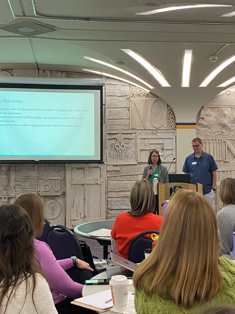 6:1:2 teacher Ian Wiernicki and speech language pathologist Erin Reed presenting in Albany