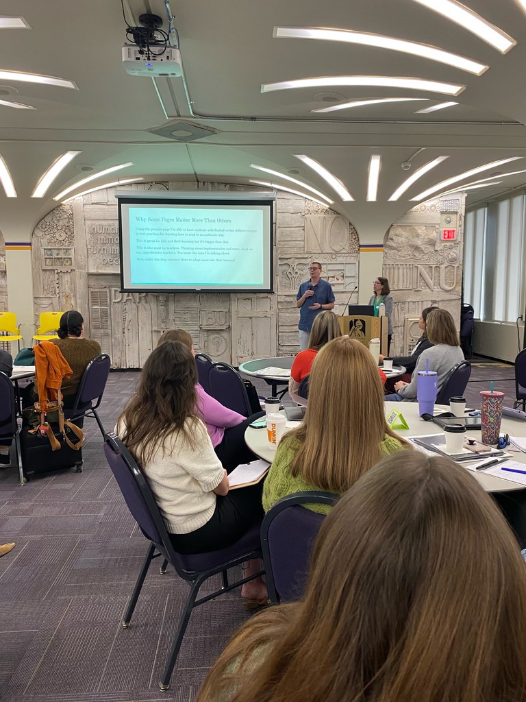 6:1:2 teacher Ian Wiernicki and speech language pathologist Erin Reed presenting in Albany