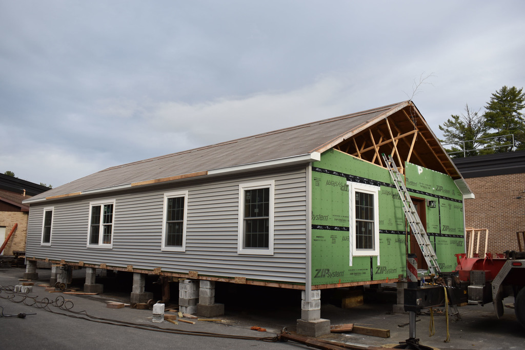 Building Construction house with a branch on it