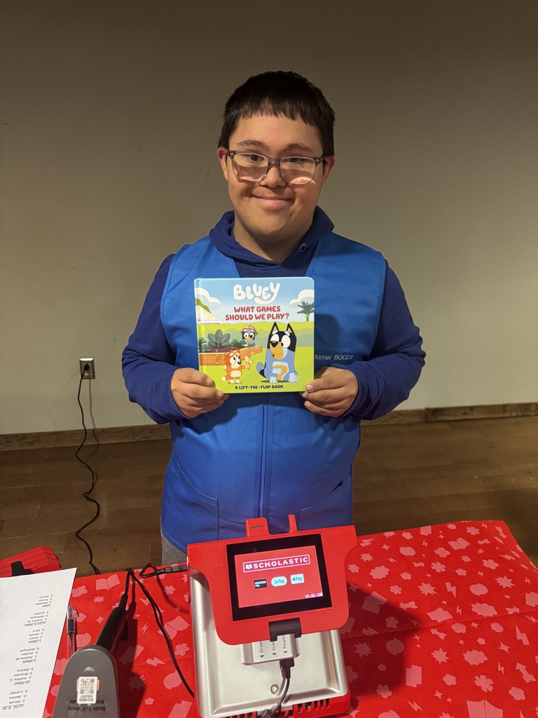 Student helping at book fair