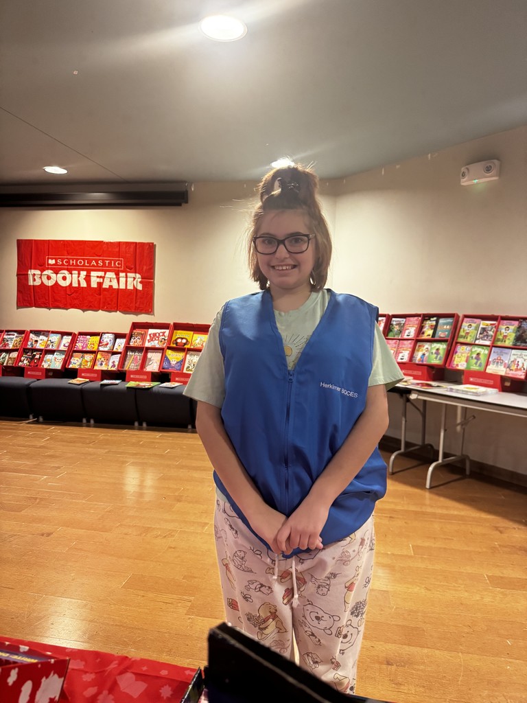 Student helping at book fair