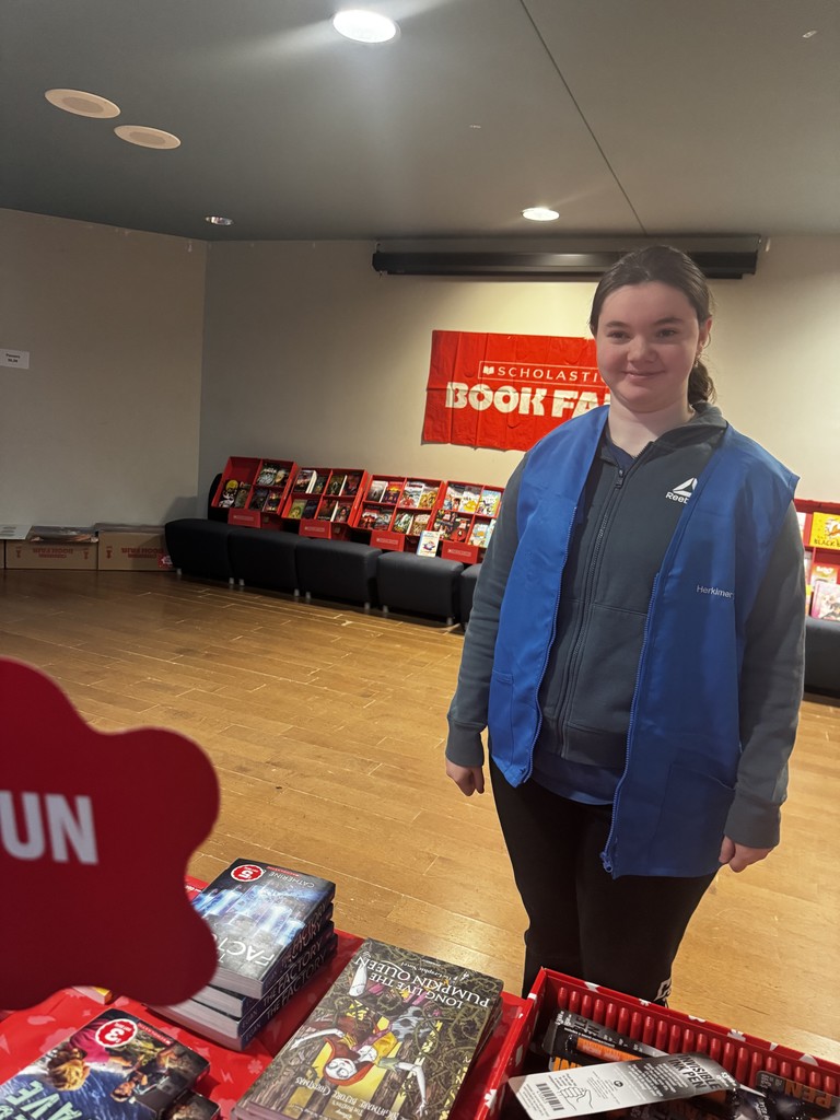 Student helping at book fair