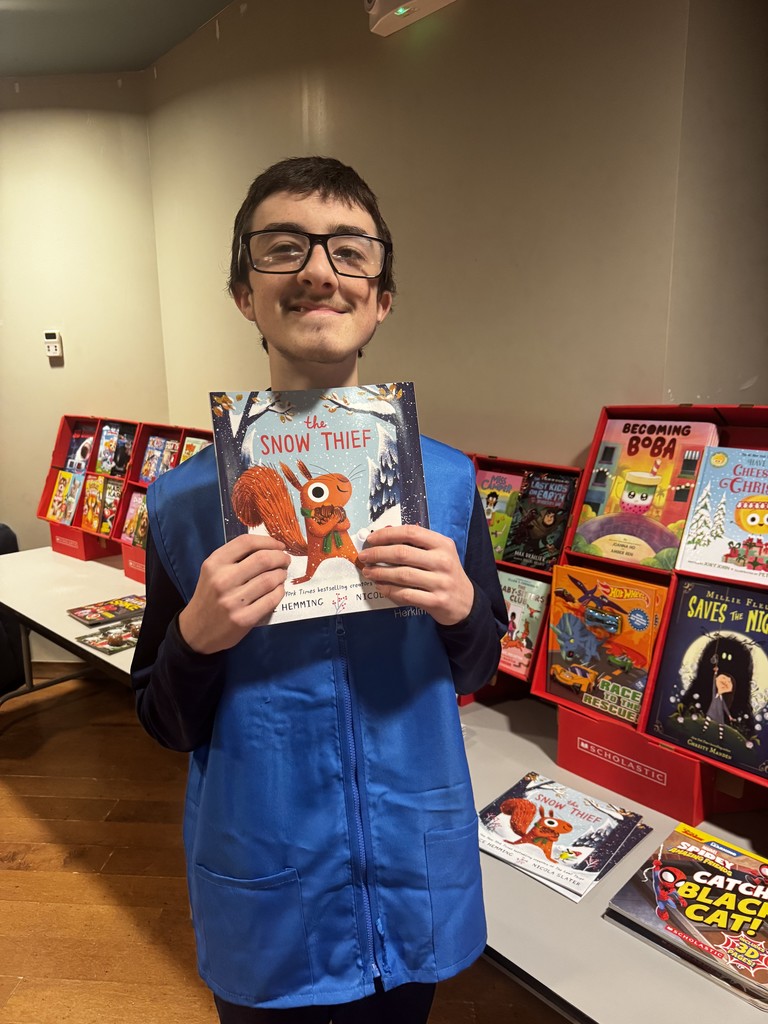 Student helping at book fair