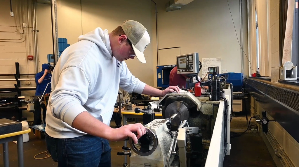 Advanced Manufacturing student operating machinery