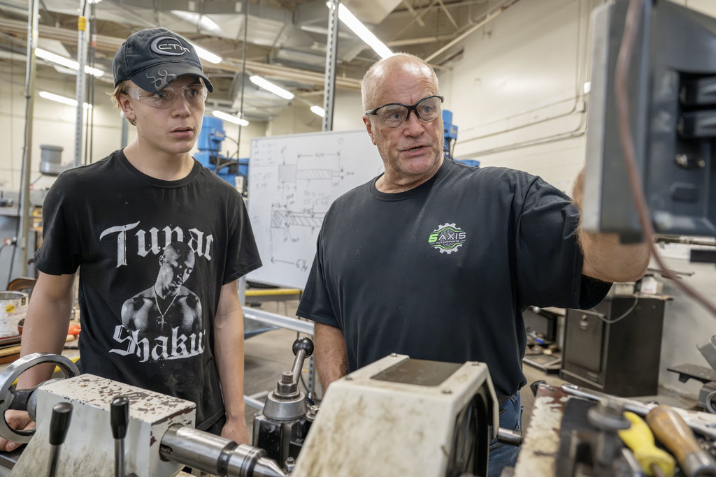 Advanced Manufacturing student and teacher working in class