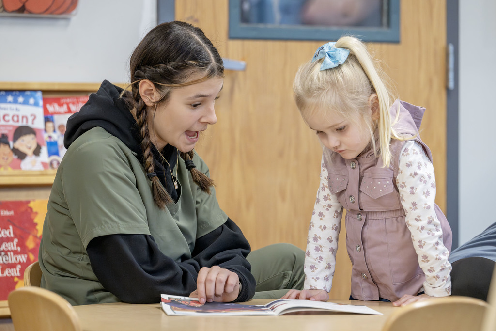 Child Family Services student working with a child during class