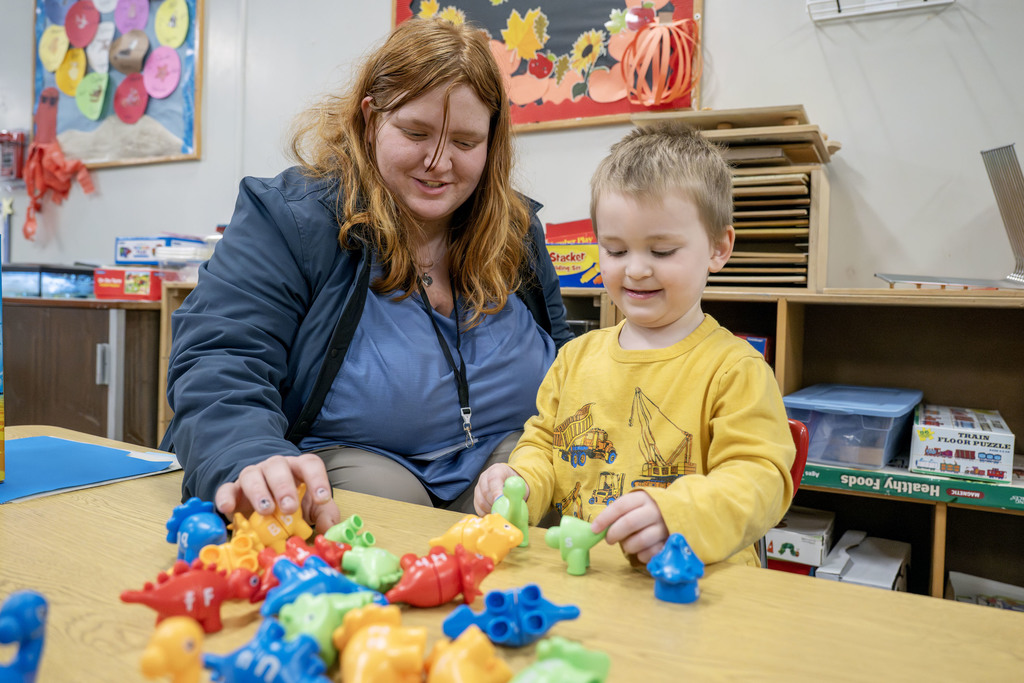 Child Family Services student working with a child during class