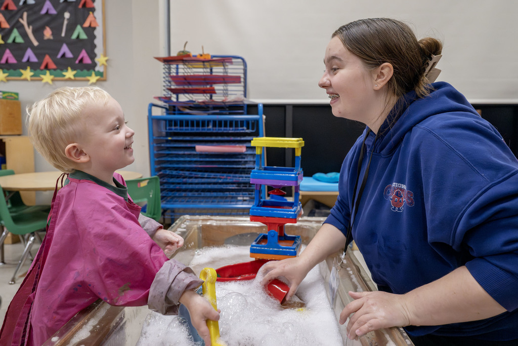 Child Family Services student working with a child during class