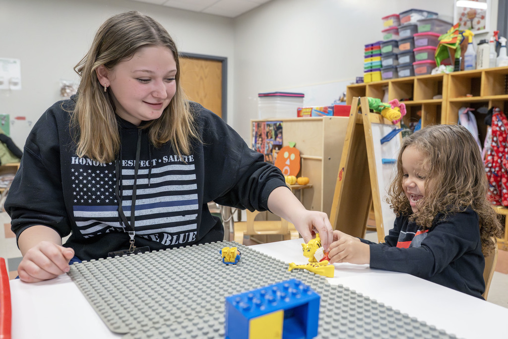 Child Family Services student working with a child during class